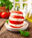 Preparing cheese and tomato salad Royalty Free Stock Photo