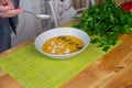 Preparing chicken stock with vegetables bouillon in a pot. Black chalkboard as background. Royalty Free Stock Photo