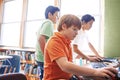 Preparing children for future computer use. elementary children working on computers at school. Royalty Free Stock Photo