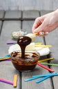 Preparing chocolate dipped banas dessert Royalty Free Stock Photo