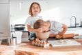 Preparing Christmas cookies. Little boy and girl on the kitchen Royalty Free Stock Photo