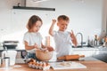 Preparing Christmas cookies. Little boy and girl on the kitchen Royalty Free Stock Photo