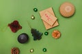 Preparing Christmas decor and gifts, still life composition on green background Royalty Free Stock Photo