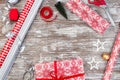 Preparing for Christmas, gift box, different wrapping paper, ribbons and toys on table, horizontal, top view, copy space Royalty Free Stock Photo