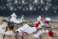 Accessories, Preparing for Christmas. Holiday decoration on slate squares, toys, garlands, on blue,and blur light ,top Royalty Free Stock Photo