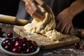 Preparing a coca de cireres, a cherry flat cake