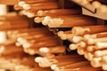 Preparing for a concert. A lot pairs of professional wooden drum sticks laying on the shelves in music studio.