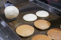 Filpping fluffy pancakes on hot plate. Royalty Free Stock Photo