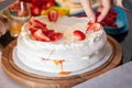 Preparing pavlova cake at home female hands