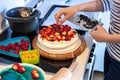 Preparing pavlova cake at home female hands