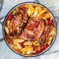 Preparing and cooking pork roast in traditional metal pot Peka.