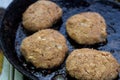 Preparing of cutlet from minced meat in frying pan Royalty Free Stock Photo