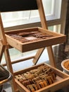 Image of breads, pastries, neatly arranged on baskets and shelves.