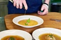 Preparing dishes - vegetable soup on restaurant kitchen