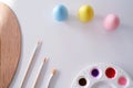 preparing for Easter. Painting easter eggs on colorful tablecloth background. Royalty Free Stock Photo