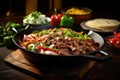 preparing fajitas: a skillet with sizzling meat and vegetables