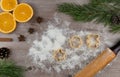 Preparing festive treats for Christmas and new year holidays. cookie molds and flour. orange and star anise.
