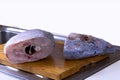 Preparing fish and cleaned cut fish on wooden board Royalty Free Stock Photo