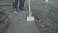 Sample for cleaning floors. A worker prepares the floor for laying ceramic tiles on the floor. Preparing the floor for Royalty Free Stock Photo