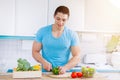 Preparing food cut vegetables young man healthy meal kitchen eat Royalty Free Stock Photo