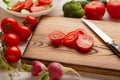 Preparing food at home. Close up wooden cutting board and chopping vegetables Royalty Free Stock Photo