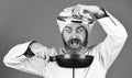 Preparing food in kitchen. Cooking food concept. High quality frying pan. Bearded cook uniform Man hold cooking pan Royalty Free Stock Photo