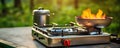 Preparing food outdoors, caming or picnic on metal gas stove Royalty Free Stock Photo