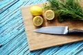 Preparing food for sauce salad by ingredient is lemon and coriander on wood block