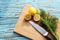 Preparing food for sauce salad by ingredient is lemon and coriander on wood block