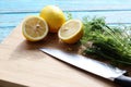 Preparing food for sauce salad by ingredient is lemon and coriander on wood block