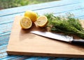 Preparing food for sauce salad by ingredient is lemon and coriander on wood block