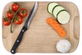 Preparing food, slicing vegetables knife on cutting board Royalty Free Stock Photo