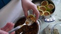 Preparing fresh stuffed zucchini for table, a cook cooks stuffed zucchini