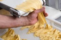 Preparing freshly made tagliatelle Italian pasta Royalty Free Stock Photo