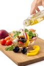 Preparing greek salad with olive Royalty Free Stock Photo