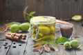 Preparing green walnut liqueur.