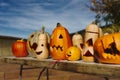 Preparing for Halloween, cleaning and carving faces on pumpkins.