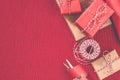 Preparing for the holiday - gift wrapping in red and beige wrapping paper