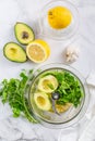 Preparing homemade avocado dressing or dip in food processor Royalty Free Stock Photo