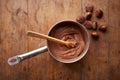 Preparing homemade chestnut cream on a pot