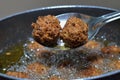 Preparing homemade CHINESE fried DRY MANCHURIAN BALLS in vessel Royalty Free Stock Photo