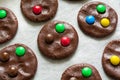 Preparing homemade chocolate cookies decorated with colored candy drops Royalty Free Stock Photo