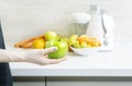 Preparing homemade fresh juice made with apples, oranges and carrots. Royalty Free Stock Photo