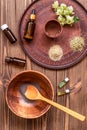 Preparing homemade mask with clay. A lot of ingredients for home made cosmetics in background Royalty Free Stock Photo