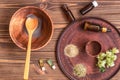 Preparing homemade mask with clay. A lot of ingredients for home made cosmetics in background Royalty Free Stock Photo