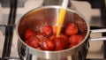 Preparing Homemade Strawberry Jam in Saucepan.