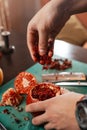 Preparing hookah for smoking. putting wet tobacco into a bowl made from a pomegranate. Royalty Free Stock Photo