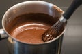 Preparing hot chocolate in metal saucepan Royalty Free Stock Photo