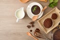 Preparing hot chocolate recipe with lingredientes on kitchen table top Royalty Free Stock Photo