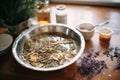 preparing hot herbal bath with dried lavender and rose buds Royalty Free Stock Photo